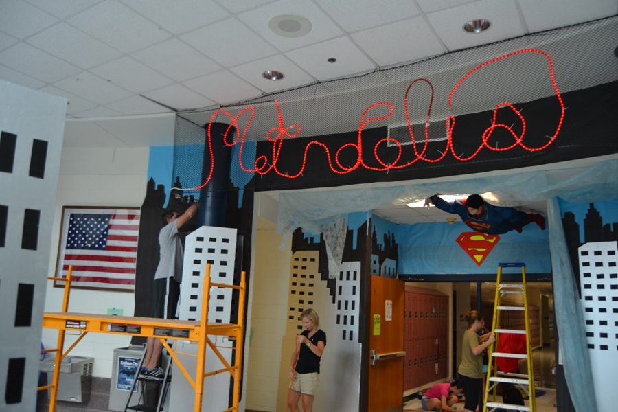 In preparation for homecoming week, members of the class of 2018 Executive Board and their parents, work diligently to finish the 700 hallway in superman paraphernalia. The homecoming pep rally will be held Friday at 2:55 p.m. in the gym.
