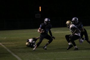 Junior linebacker Ryan Cockes evades a Morrow defender during a punt return. The Panthers defense forced four turnovers and four punts against the Mustangs.