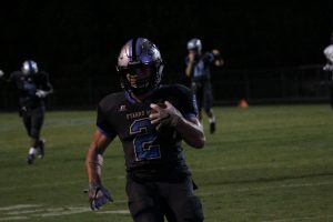 Juniors Nick Brown and Joey DeLuca celebrate a touchdown by Gilley. He found the end zone six different times, which is a Starr’s Mill record.