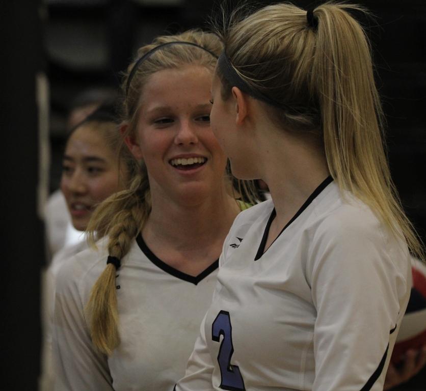 After gaining a point, two Lady Panthers converse. “We work well as a team and we communicate well,” freshman Hannah Yokosawa said.