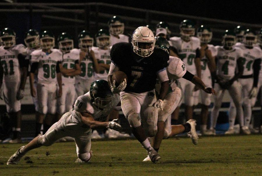 Junior running back Nick Brown shrugs off a defender against McIntosh on the way to his 136-yard performance. The Panthers totaled 379 rushing yards against the Chiefs.