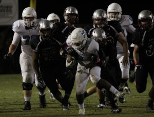 Junior running back Nick Brown tries to break away from a Wildcat defender. Brown scored both of his touchdowns during the Panthers’ fourth quarter rally.