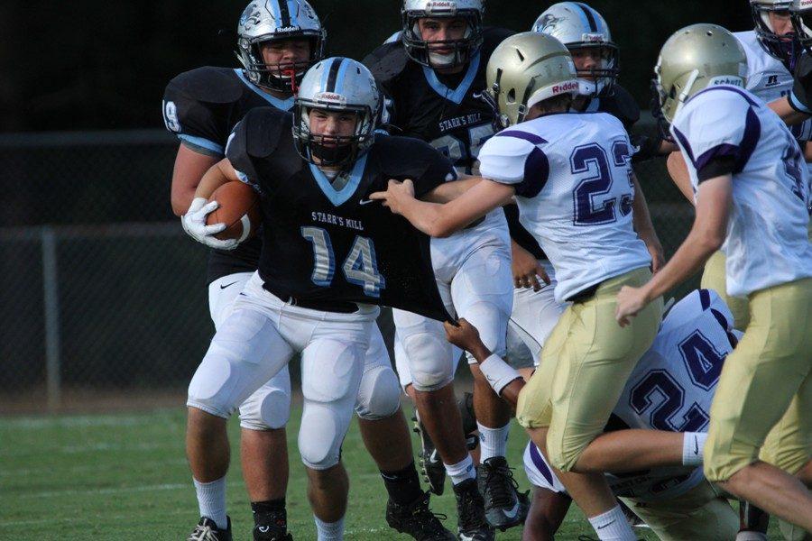 Panther player sheds a tackle and runs for a first down. The Starr’s Mill run game could not be stopped by the East Coweta defense. 