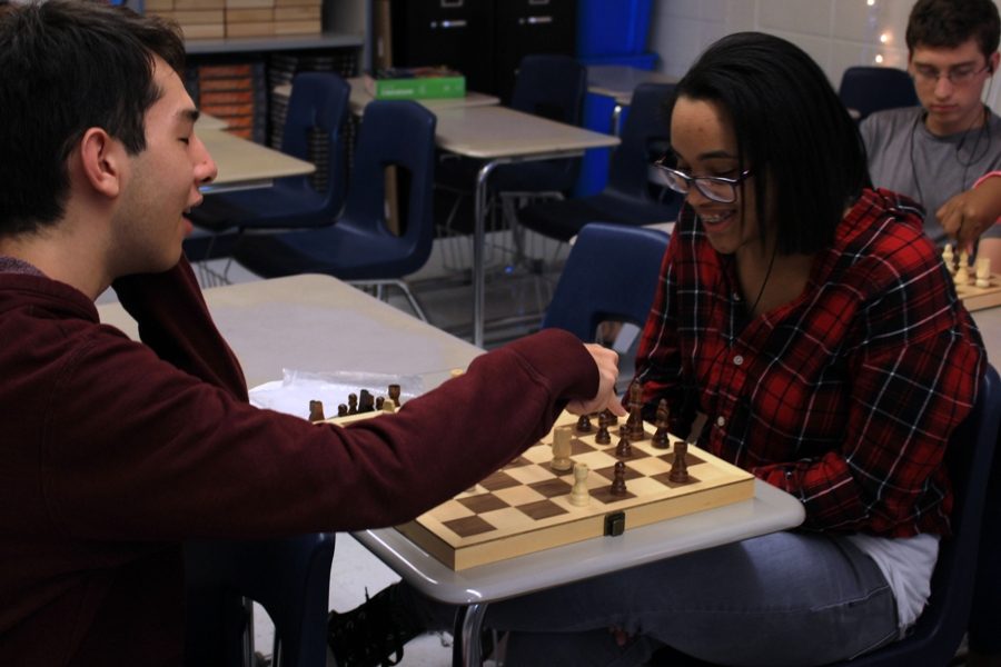 Two members of Chess Club name the different pieces on the board. The club is open to all students and meets twice a month in English teacher Katherine Tucker’s room 720.