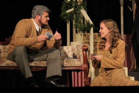 Adolf Freitag plays cards with his niece when she arrives home from college. A number of the scenes that occurred in Adolf’s house revolved around the staircase set piece that was constructed by Starr’s Mill Productions co-president Darril Bill and volunteer set designer Steve Rambeck. In the days leading up to opening curtain, members of the Advanced Drama II class also helped paint the staircase.