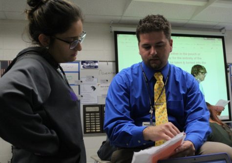 English teacher, creative writing teacher, and journalism adviser Justin Spencer helps explain a concept in his 10th grade Literature and Composition class. “Man, teaching is great. Working with students, interacting with students, sharing conversations, sharing ideas, laughing, and making it enjoyable [is what I love about teaching],” Spencer said.