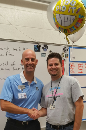 Spencer poses with principal Allen Leonard after his class was briefly interrupted with the arrival of balloons, cameras, and several other administrators to notify him that he had been named Starr’s Mill’s TOTY. Fellow colleague of 11 years and psychology teacher Sean Hickey said that “Mr. Spencer combines a mastery of subject content, student engagement and school spirit.  He is an outstanding and exemplary teacher.”