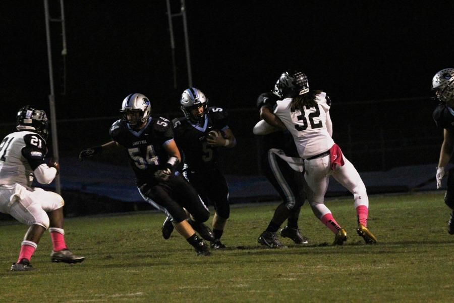 Panther offensive line makes a hole for junior Mitch Prowant. The offensive line played a huge role in the Panthers breaking the school record for rushing yards in a single game with 526.