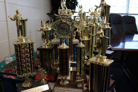 Trophies begin to pile up as front office secretary Leslie Frey catalogs them before handing them off to the coaches. The school’s most important trophies will be placed chronologically around the rotunda. Additional trophies will be given to the coaches at the Mill, who will then have to figure out what to do with them. 