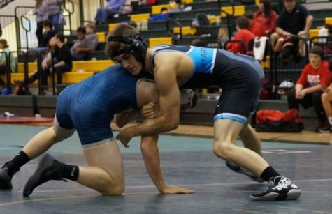 A Panther wrestler grapples with an opponent. Starr’s Mill hosted the Area Duals earlier this month and placed 2nd overall.