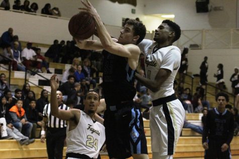 A Panther player battles for a rebound with a Fayette County player. One bright spot for the Panthers in the 81-63 loss was out-rebounding the Tigers 25-22.