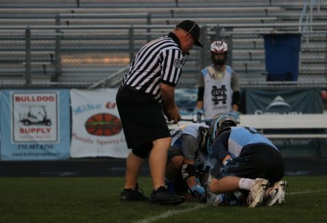 Two Panther players face off to start their preseason scrimmage. The Panthers look for redemption after losing in the first round of last year’s playoffs.