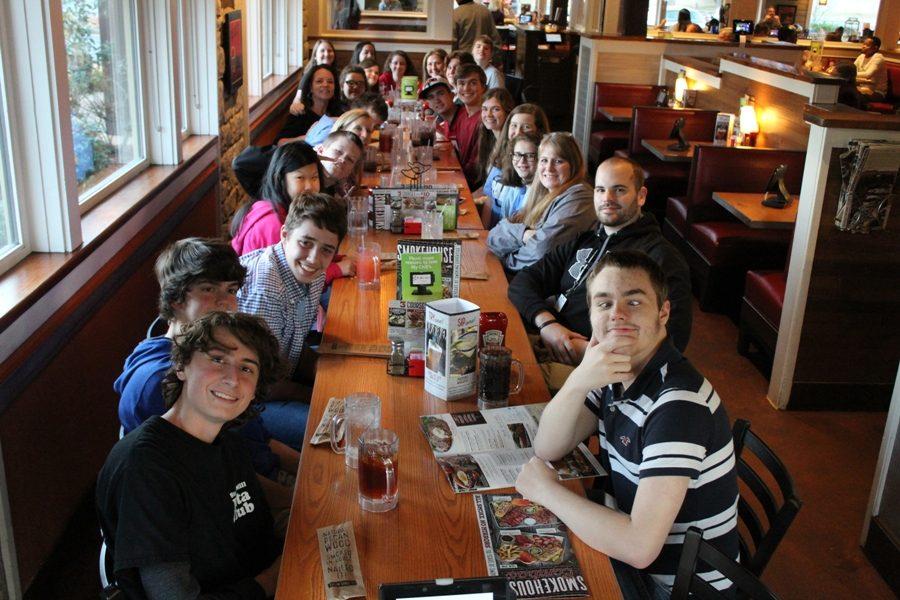 The PALS club enjoys a meal together.  The event improved important life skills, including tipping and paying a bill, for all the attendees.