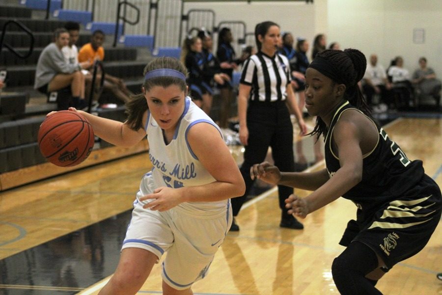 A Panther player drives through a Morrow defender on her way to the basket. The girls were unable to make the state playoffs and finished 12-13, a step down from last season’s 15-10 record.