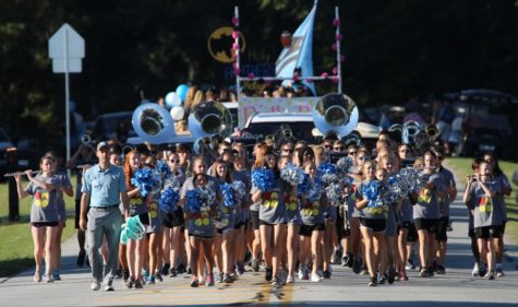 The Panther Pride Marching Band leads the 2016 Homecoming parade. The band is ready to return to the field in the fall to perform their new show, a modernized rendition of “Swan Lake.”