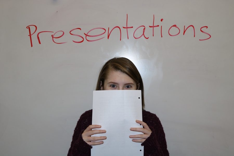 A student prepares to deliver her speech in front of the class. Students who suffer from anxiety may experience a panic attack while presenting material in front of a class, causing a harmful and embarrassing experience for the affected student.