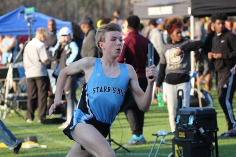 A Starr’s Mill runner prepares to exchange the baton with a teammate in a relay race. “Our 4X4 team is solid, but we need to improve in our hurdling,” Walker said. 