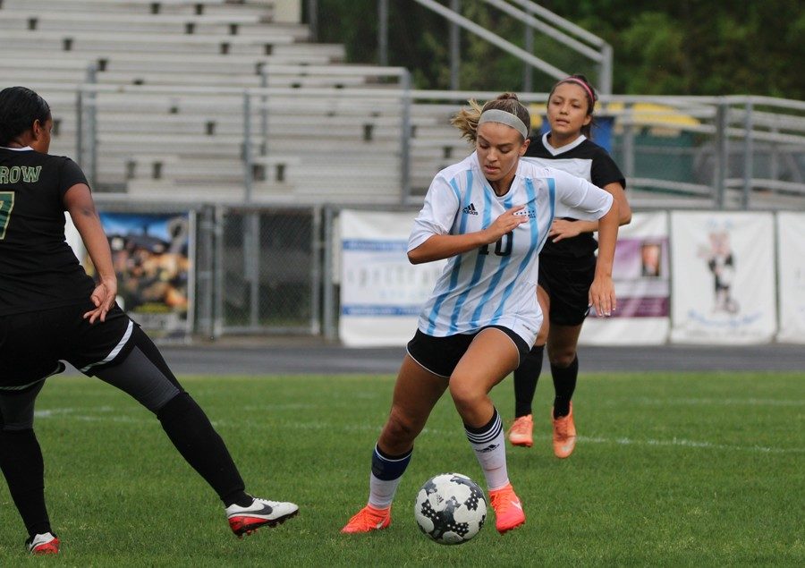 A Lady Panther dribbles the ball around a defender. The Lady Panthers defeated Morrow 11-0 in a mercy rule shutout, improving the Lady Panther record to 7-8-1 overall and 4-2-0 in the region.
