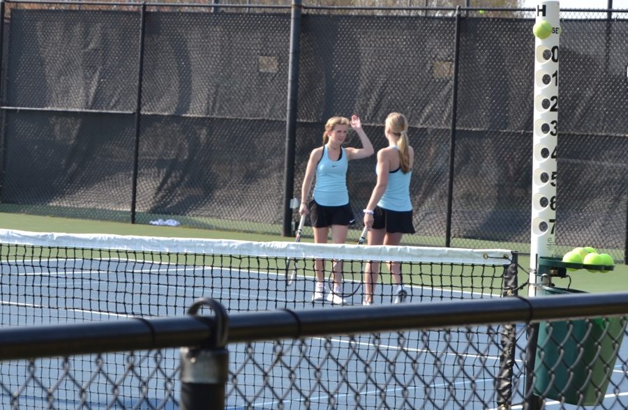 Senior+Olivia+Walker+and+sophomore+Megan+Fox+high-five+in+their+doubles+match+against+McIntosh.+The+Lady+Panthers+won+4-1+in+the+match+against+McIntosh.+