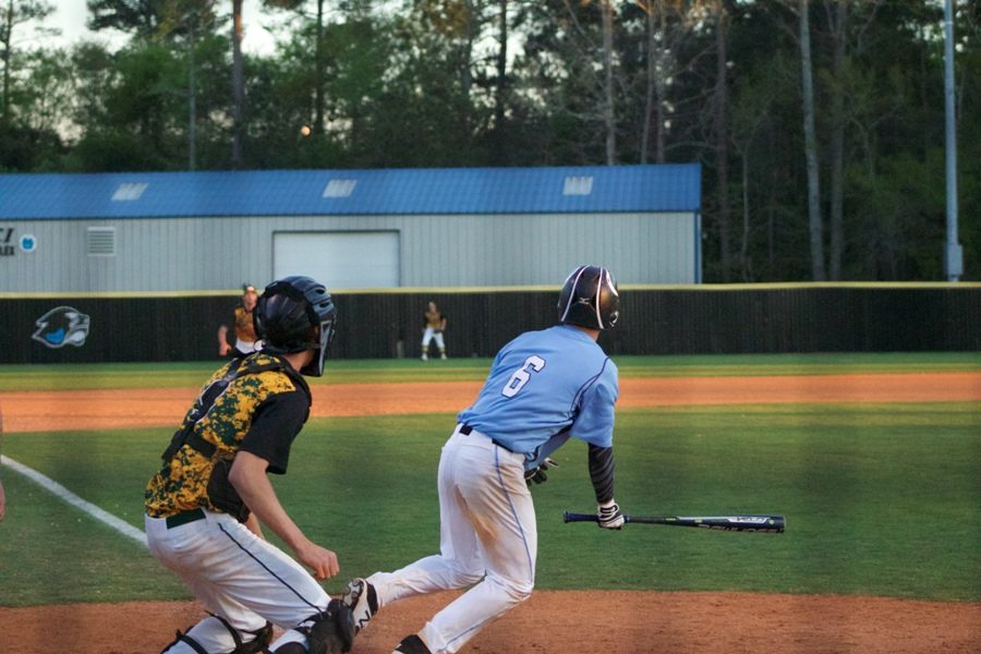 Senior Will Evans heads to first base after making contact with the ball in the third game of the series against Griffin. The Panthers defeated the Bears 10-5.