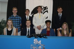 Class of 2017 band members and college band signees pose for a photo to honor their achievements.