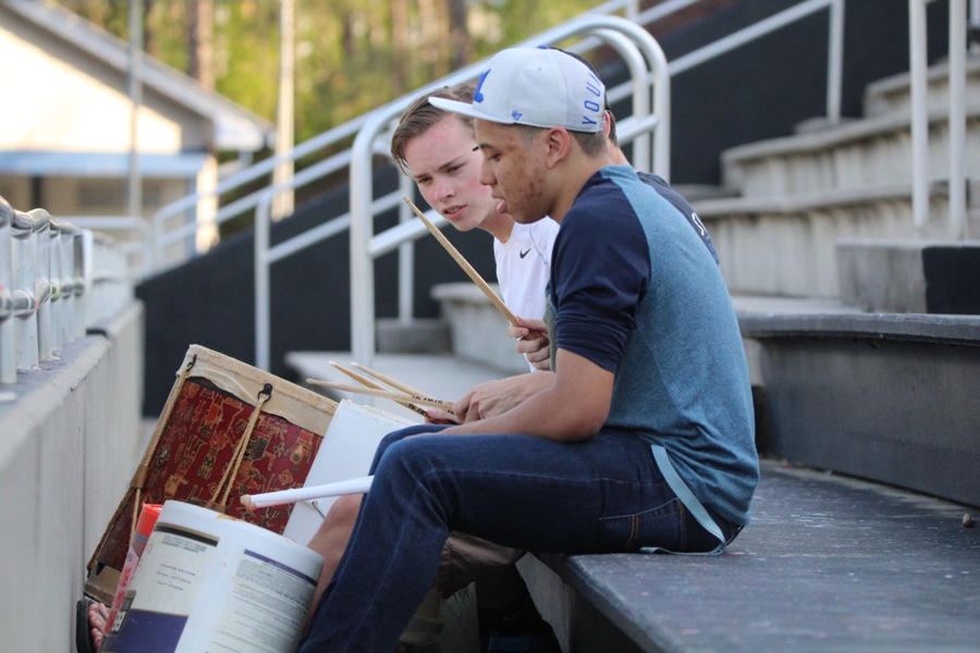 Members+of+the+Mill%E2%80%99s+Bucket+Brigade+set+the+beat+for+a+girls%E2%80%99+varsity+soccer+game+against+Whitewater.+This+student-created+and+student-led+organization+brings+an+assortment+of+drums+and+buckets+to+the+stands%2C+cheering+on+players+and+pepping+up+fans+during+the+spring+sport+season.