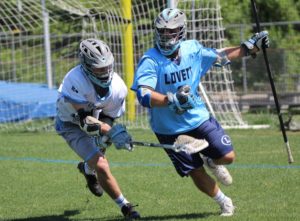 A Panther player defends a Lion player behind the goal. The Lions’ quick offense used ball movement and cuts to tear up the Starr’s Mill defense.