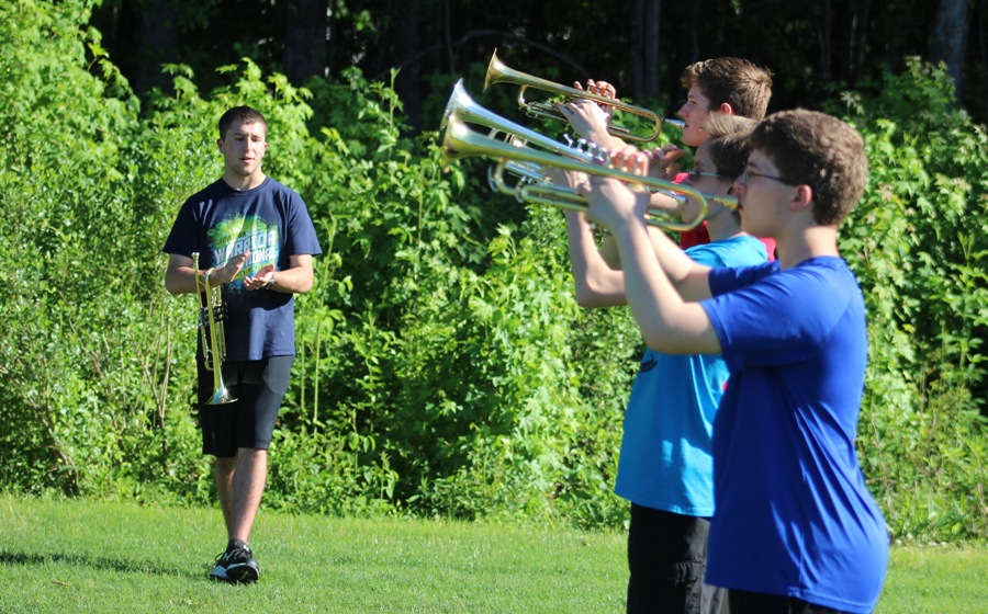 Upcoming+senior+Ryan+Ragsdale+assists+trumpet+members+during+marching+band+rehearsal.+Panther+Pride+Marching+Band+already+prepares+for+their+2017+season%2C+when+they+will+perform+a+rendition+of+Swan+Lake.+