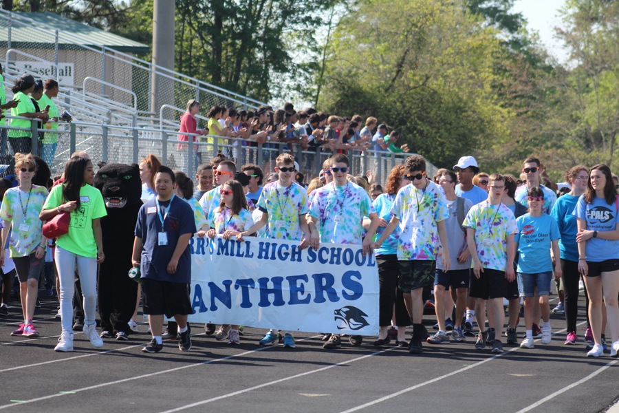 Athletes and volunteers for the annual Fayette County Special Olympics walk around the track at McIntosh High School for the Opening Ceremonies. Special Olympics is an annual event that allows students with disabilities an opportunity to showcase their athletic talents and to spend time with their peers’. 