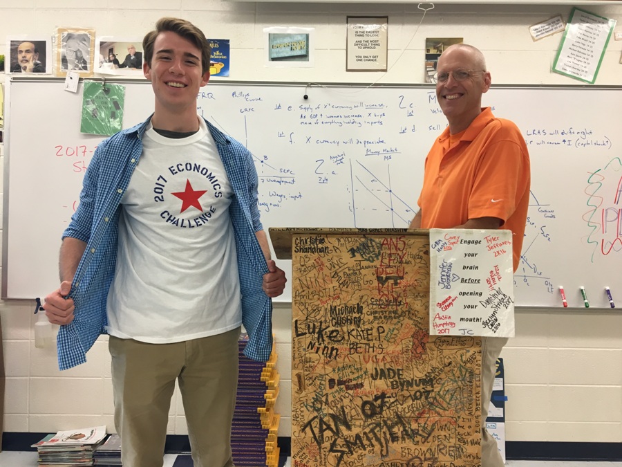 A member of Econ Club shows off the shirts made to honor the Econ Challenge. This year’s team did not place in the annual Econ Challenge held at the Atlanta Federal Reserve, but Decourcy plans on attending next year. 