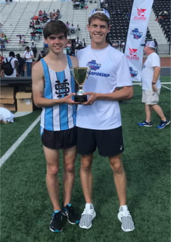 Sophomores Harrison Fultz and Nick Nyman hold a trophy after competing during the Georgia High School Association AAAAA state meet. Most of the boys and girls from this year’s teams will return to the Mill to compete next year.