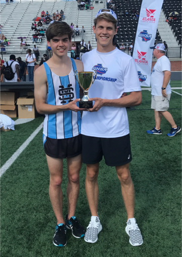 Sophomores Harrison Fultz and Nick Nyman hold a trophy after competing during the Georgia High School Association AAAAA state meet. Most of the boys and girls from this year’s teams will return to the Mill to compete next year.