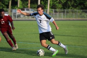 A Panther soccer player kicks the ball through the box toward the goal. The Mill defeated the Warner Robin Demons 11-1.