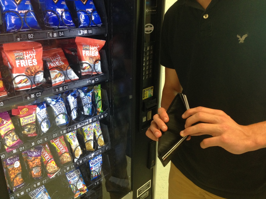 A student intends to purchase a snack from the 700 hall vending machine, but when reaches to pull out a one dollar bill, he finds that he realizes he has no money to spend. According to many students, including freshman Olivia Wernecke, food is one of the main attractions for students’ wallets.  “Its definitely easiest for Starr’s Mill students to spend money on food because its something for them to do with friends. They take the one minute drive from the school parking lot to Chick-fil-a and they sit down and socialize,” Wernecke said.