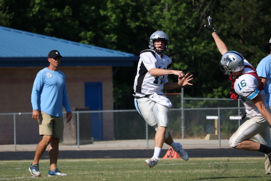 Upcoming senior quarterback Joey DeLuca rolls out during a pass play. DeLuca will lead the Panthers offense one last time, as the loaded class of 2018 seeks a shot at the state championship.