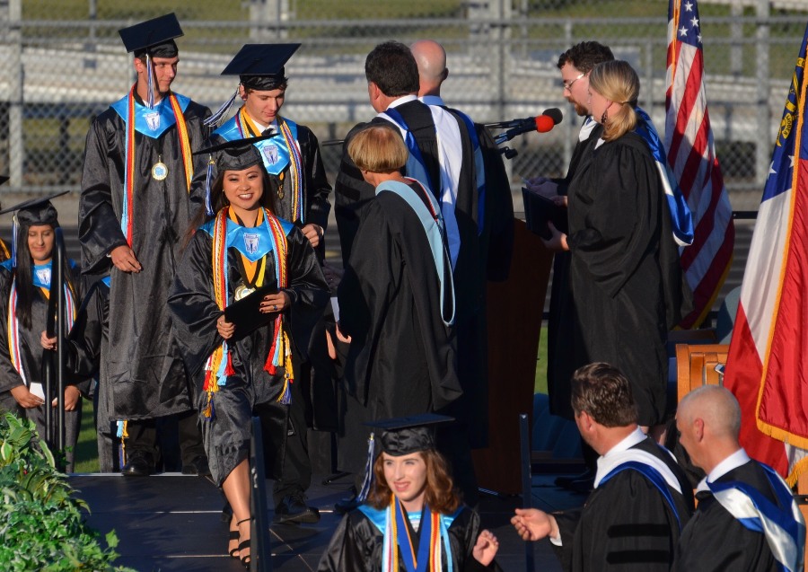 The first few members of the Mill’s Class of 2017 to graduate flash broad smiles as they receive their diplomas. Graduating from high school is a landmark event in most teenagers’ lives, but what comes after the walk?