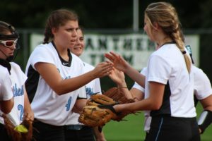 Two Panther players celebrate after an out during their win over Griffin. The Panthers defense played exceptionally well, as they did not allow a single run.