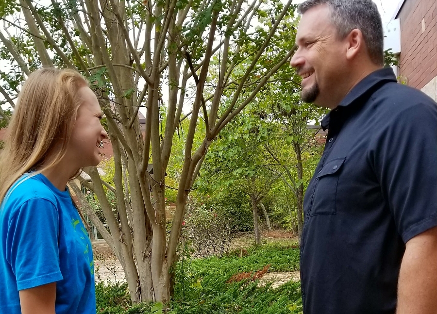 History teacher Jason Flowers has a casual conversation with his daughter. Students do not appreciate an overabundance of interest in their academics and desire a broader range of discussion topics. 