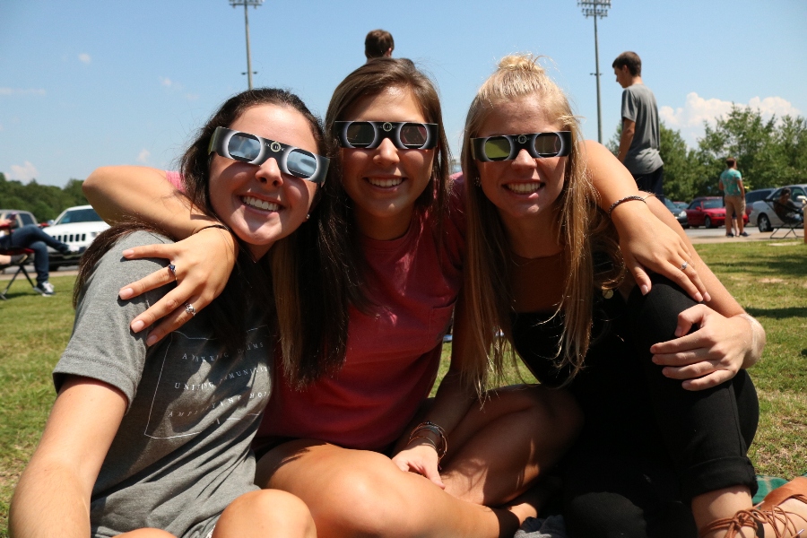 Starr’s Mill High School students gather outside to watch the solar eclipse. The eclipse attracted the attention of millions of Americans as it traveled the full length of the United States on Aug. 21.