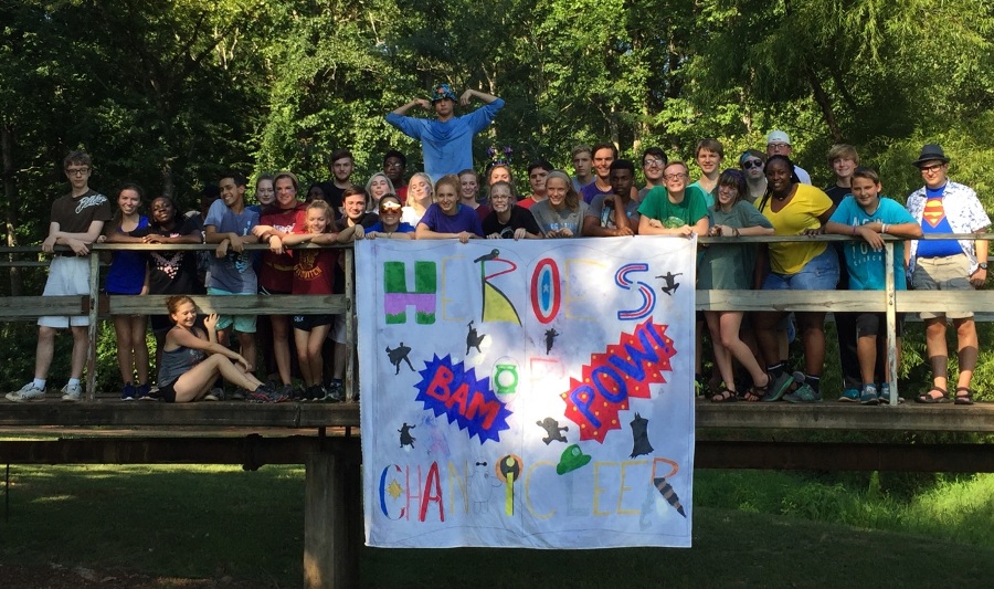 Underclassmen pose for a picture with their banner. Their banner was hero themed while the seniors’ banner was villain themed.