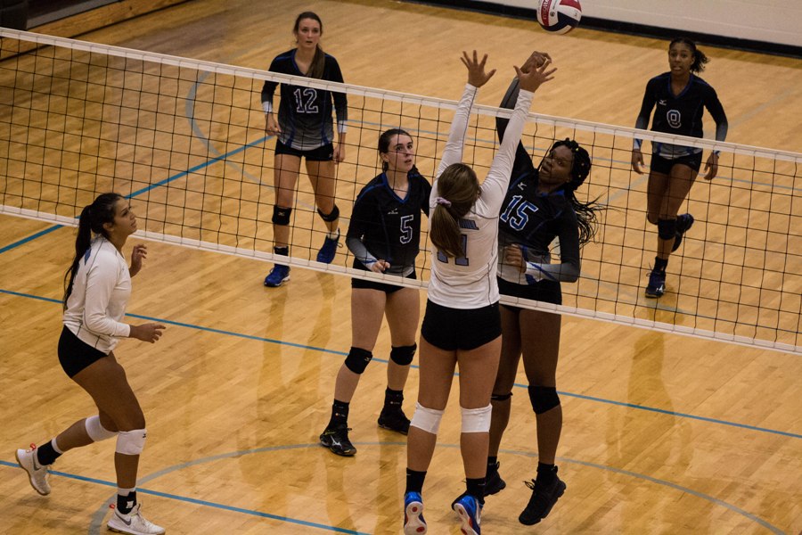 A Lady Panther jumps up to block the ball. On Aug. 22, Starrs Mill split matches against Columbus and Trinity, defeating Trinity 2-0 and losing to Columbus 2-0.