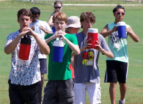 Panther Pride Marching Band students rehearse during band camp in July. The students powered through the Georgia summer heat in order to learn the show. 