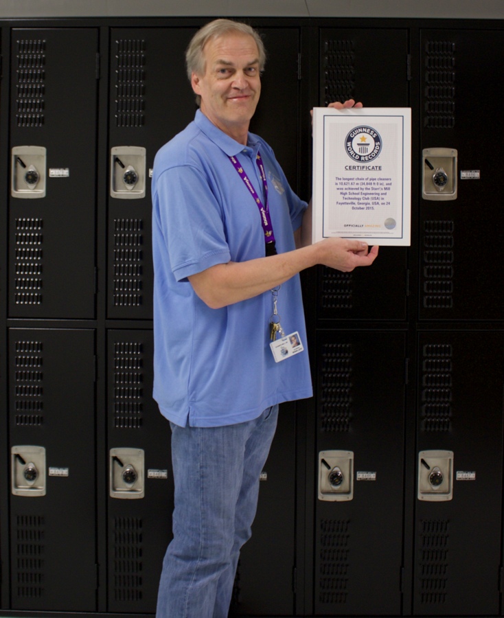 Starr’s Mill technology teacher Jonathan Winkjer holds the official certificate verifying that Starr’s Mill is now in the Guinness Book of World Records. Around two years ago, the Starr’s Mill technology department succeeded in taking the world record for the longest chain of pipe cleaners. 