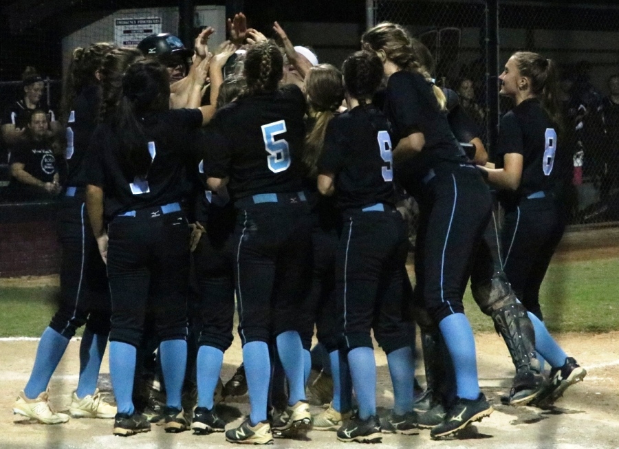 Sept. 20, 2017 - Panther players surround home plate after a seventh inning home run. Starr’s Mill hit two home runs on the night and two in their previous matchup with the Wildcats.