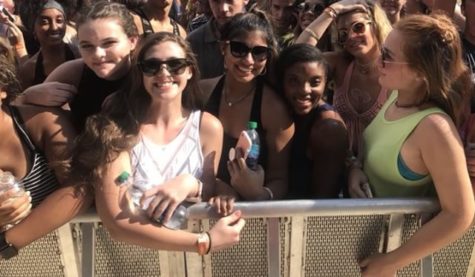 Senior Madison Bunch stands with friends Olivia Ross, Sonny Thomas, and Dani Brown at the barricade awaiting Future. Bunch had to arrive hours early in order to secure a front row view.