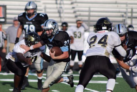 Freshman running back Nate Kearns runs the ball against Fayette County. The run game was very important to the Panther offense, as all five of their touchdowns came on the ground. 