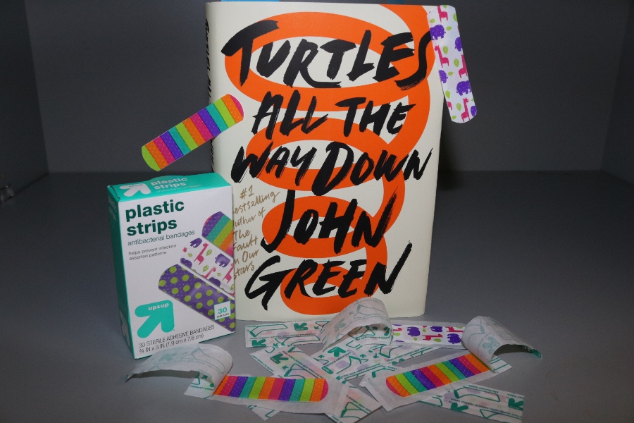 “Turtles all the way down” focuses on Aza Holmes investigating the disappearance of billionaire Russell Pickett while also struggling with her constant anxiety-ridden thoughts. This wonderfully composed story touches on love, lifelong friendship, and the hardships of mental illness, creating a realistic atmosphere that readers can truly become part of.