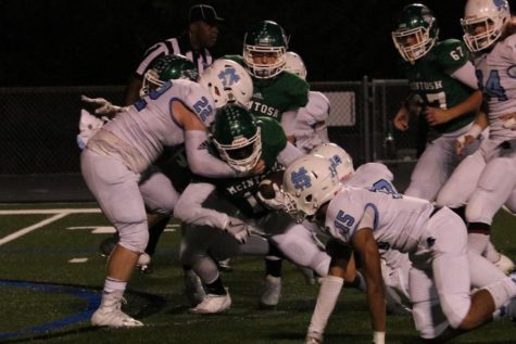 Senior Charlie Mizzell brings down a McIntosh player. The Panther defense struggled against the Chiefs, giving up 35 points to their cross-town rival.