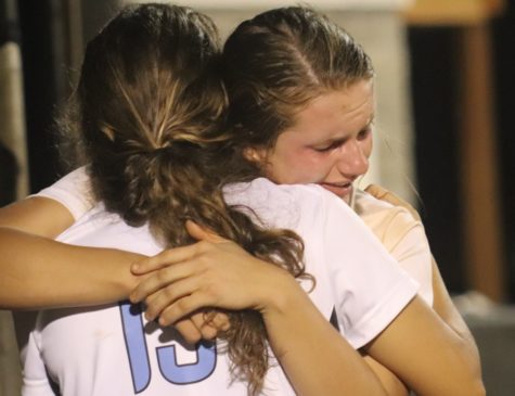 Two Lady Panthers hug after the last game of the night. Despite winning region 3-AAAA, the Lady Panthers fell to Ola in the first round of state playoffs.
