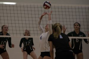 A Panther sets the ball for a teammate. The Panthers split the night, beating Griffin 2-0 but losing to McIntosh 2-0.